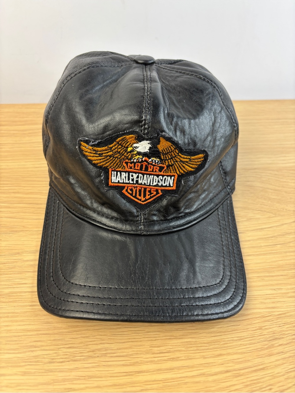 Vintage Harley-Davidson Black Leather Cap with Orange Eagle Patch